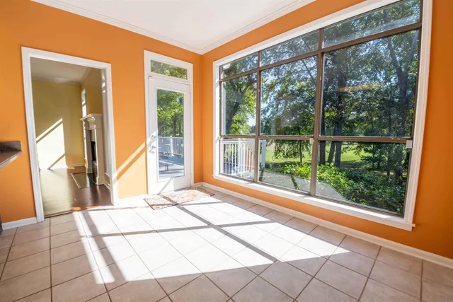 a view of a room with a large window
