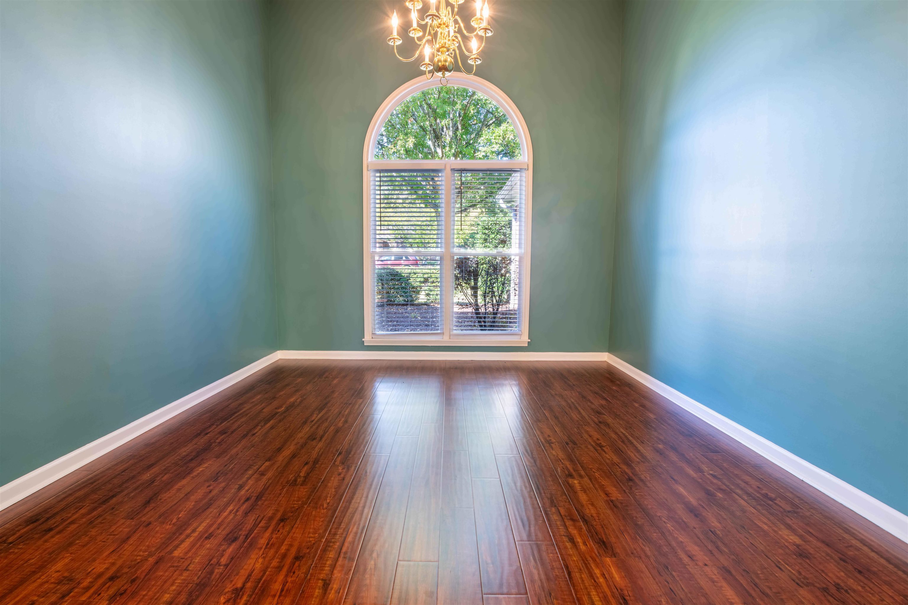 4170 Calla Drive Bartlett, TN 38135 - Photo 12 of 40 a view of an empty room with wooden floor and a window