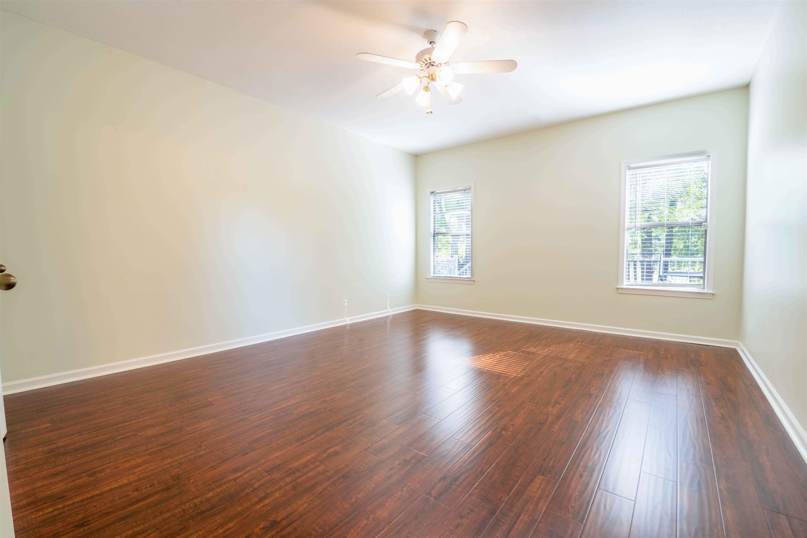 4170 Calla Drive Bartlett, TN 38135 - Photo 15 of 40 an empty room with wooden floor and windows