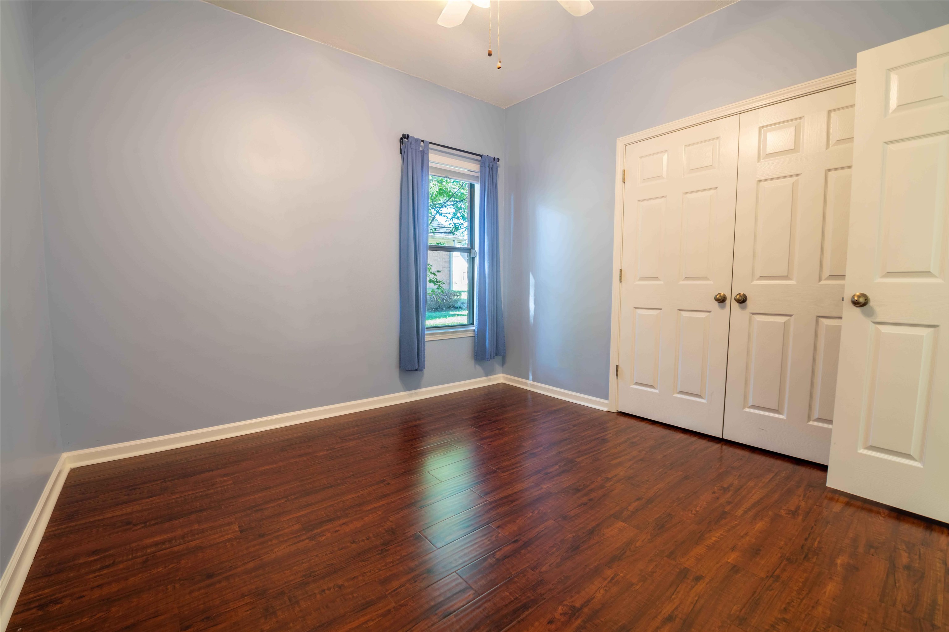 4170 Calla Drive Bartlett, TN 38135 - Photo 23 of 40 an empty room with wooden floor and windows