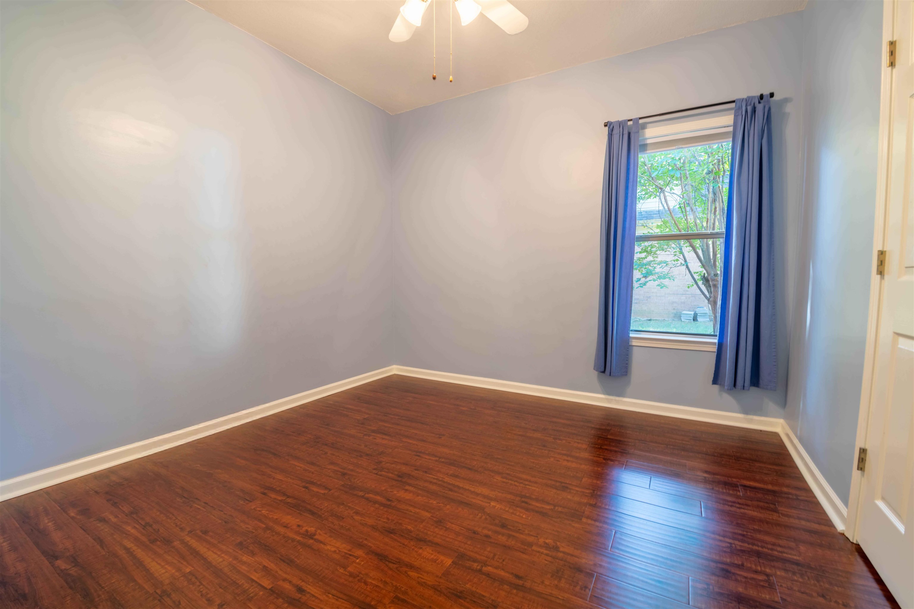 4170 Calla Drive Bartlett, TN 38135 - Photo 24 of 40 a view of an empty room with wooden floor and a window