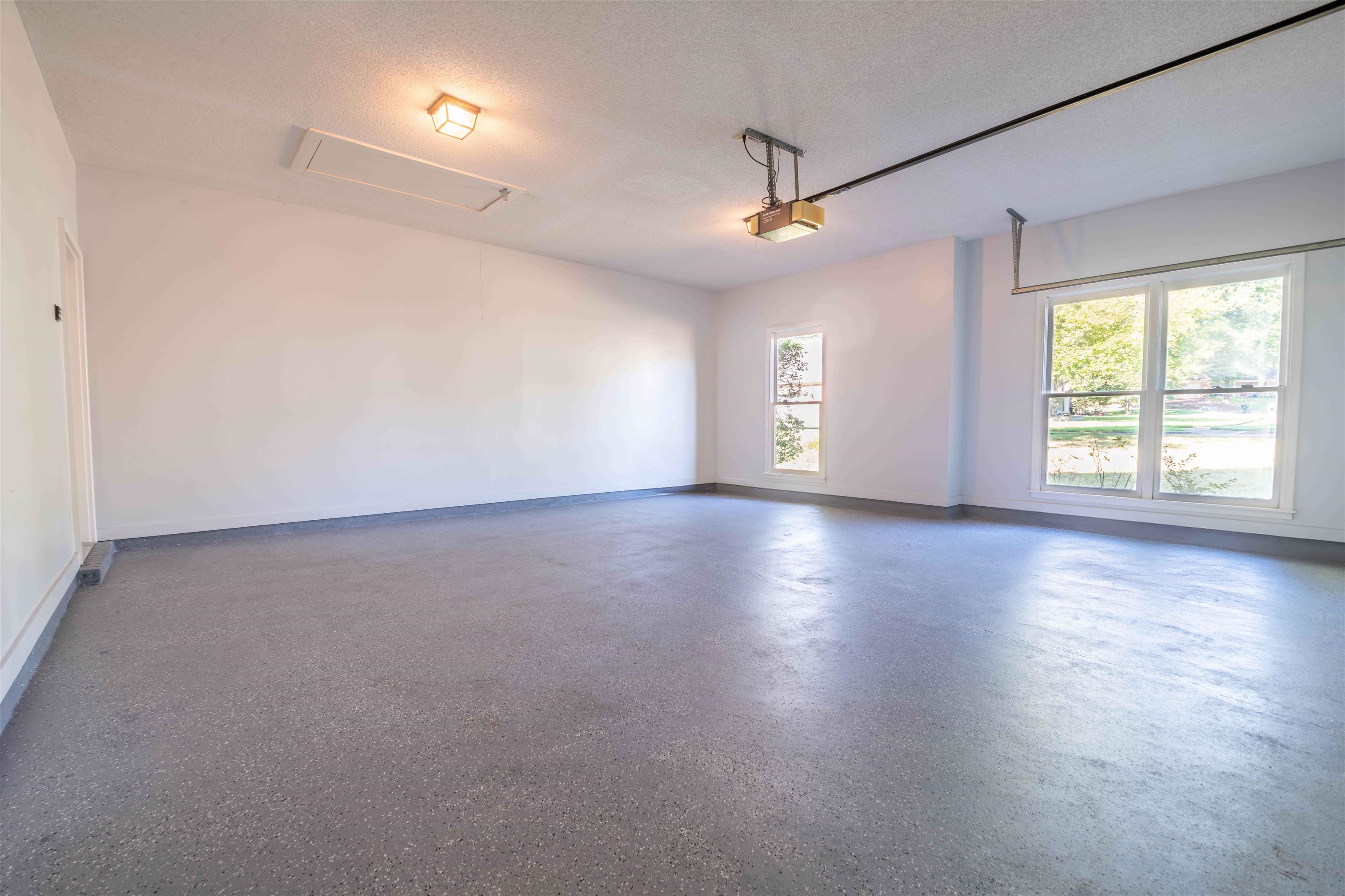 4170 Calla Drive Bartlett, TN 38135 - Photo 33 of 40 an empty room with wooden floor and windows