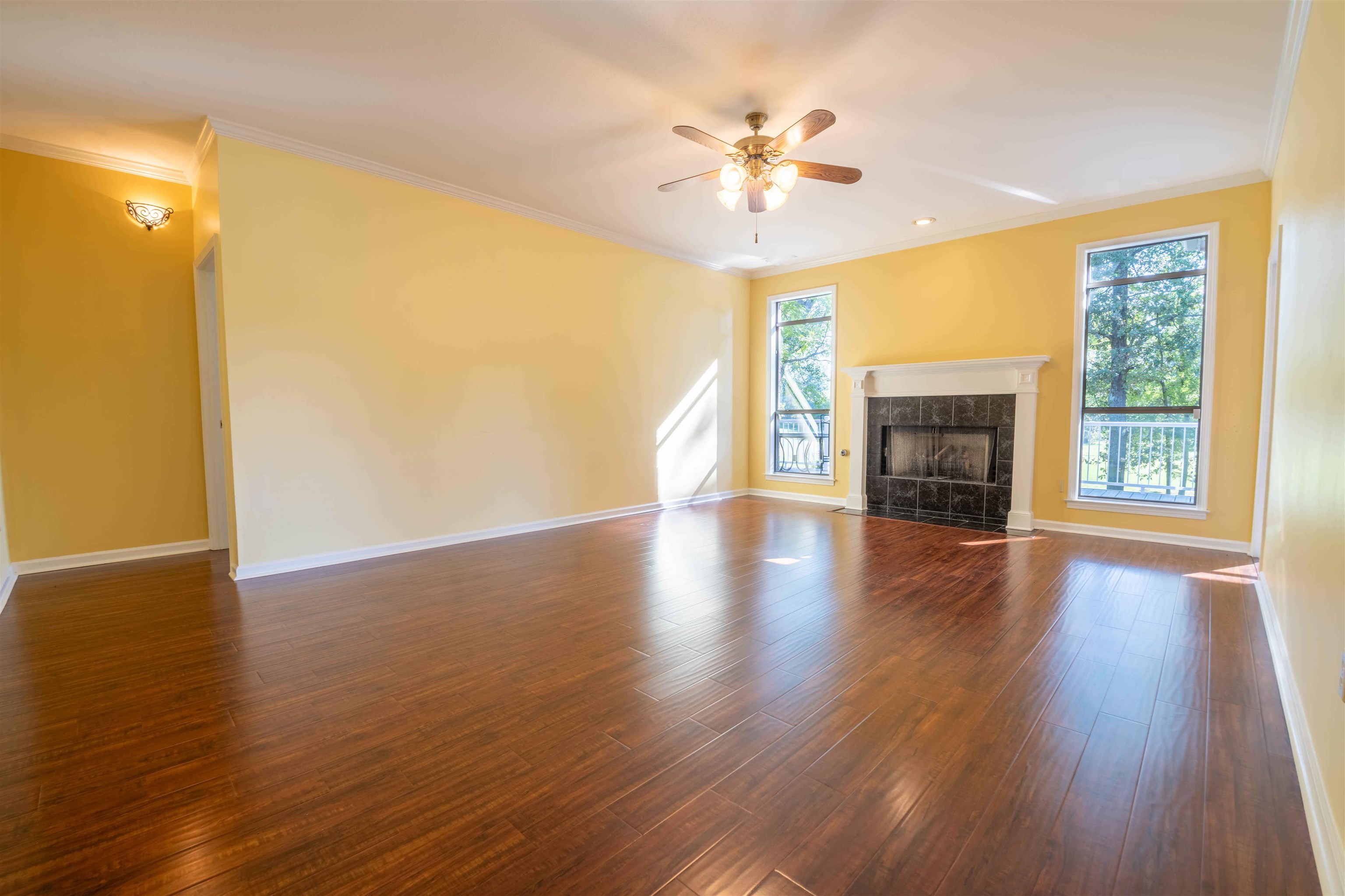 4170 Calla Drive Bartlett, TN 38135 - Photo 8 of 40 a view of an empty room with wooden floor and a window