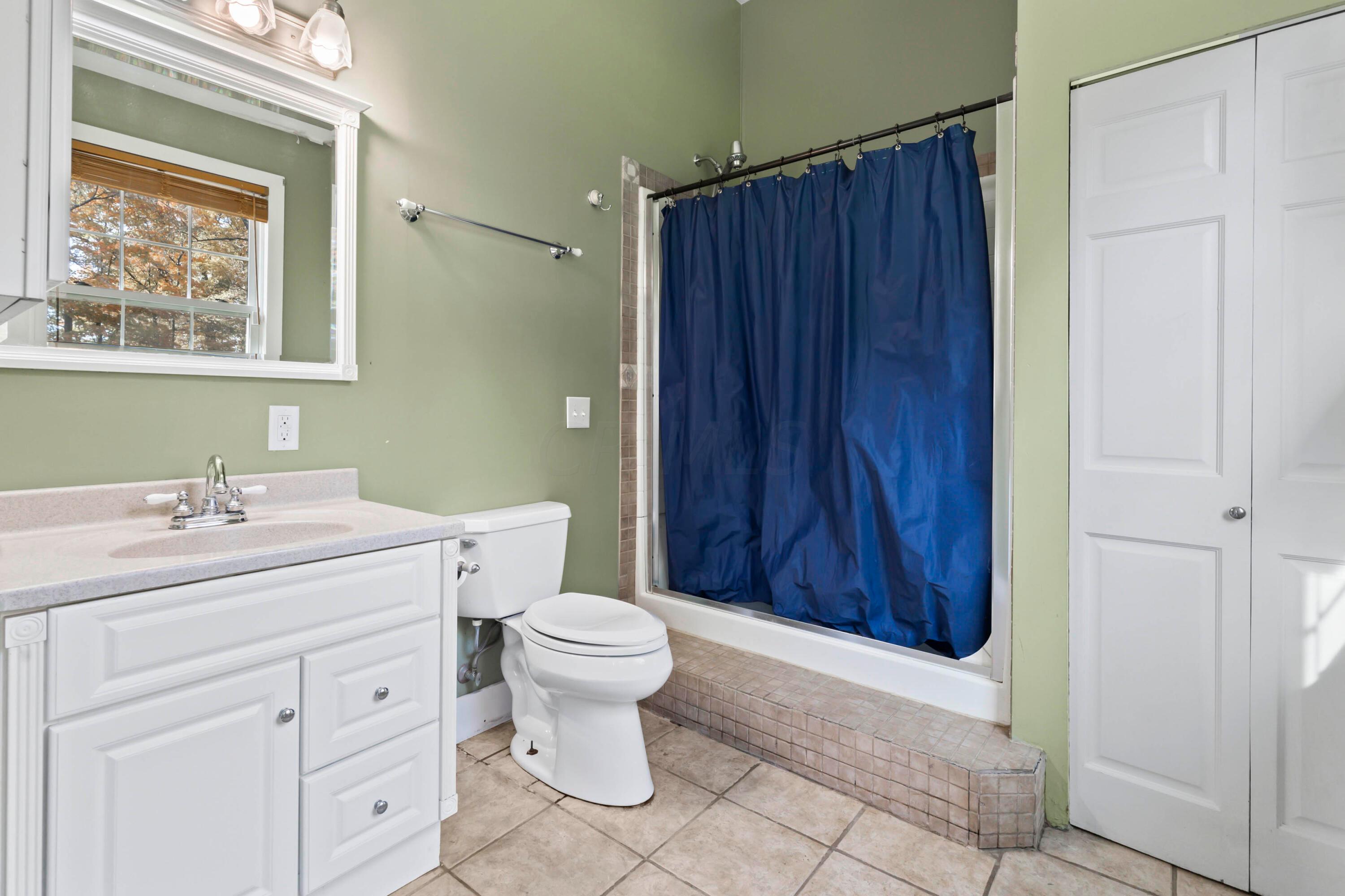 9495 Kilbourne Road Sunbury, OH 43074 - Photo 38 of 84 • Ceramic tile flooring
• Sage painted walls
• Can lighting
• Plant ledge
• Wall exhaust
• Step-up shower stall with
seating & glass doors
• Enclosed vanity with single
bowl, granite sinktop