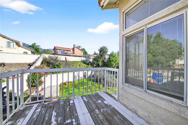 a view of a balcony with wooden floor