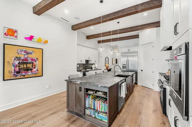 a living room with furniture a fireplace and flat screen tv