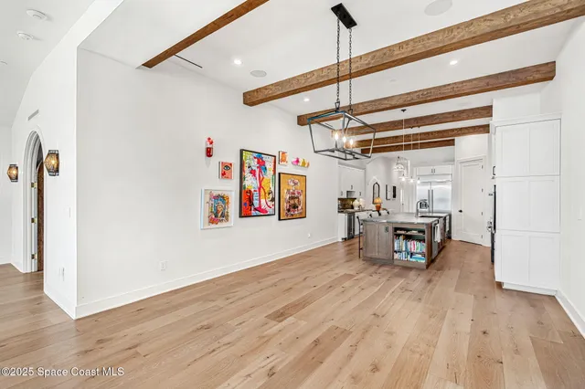 a view of a balcony with wooden floor