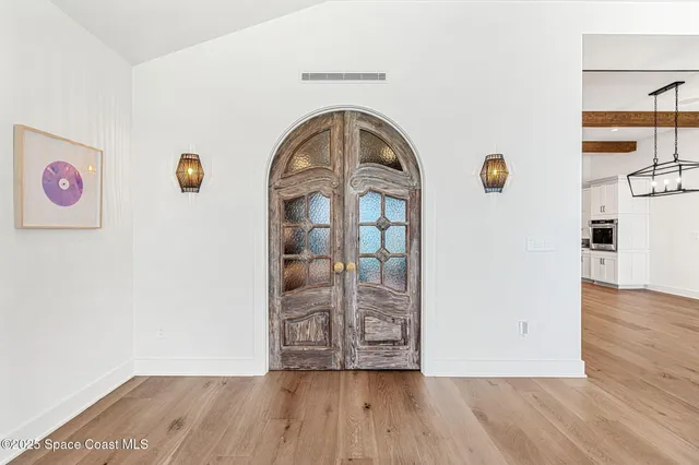 a soft toy sitting on a bed in a room