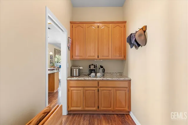 a living room with furniture and a ceiling fan