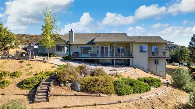 a view of a balcony with furniture