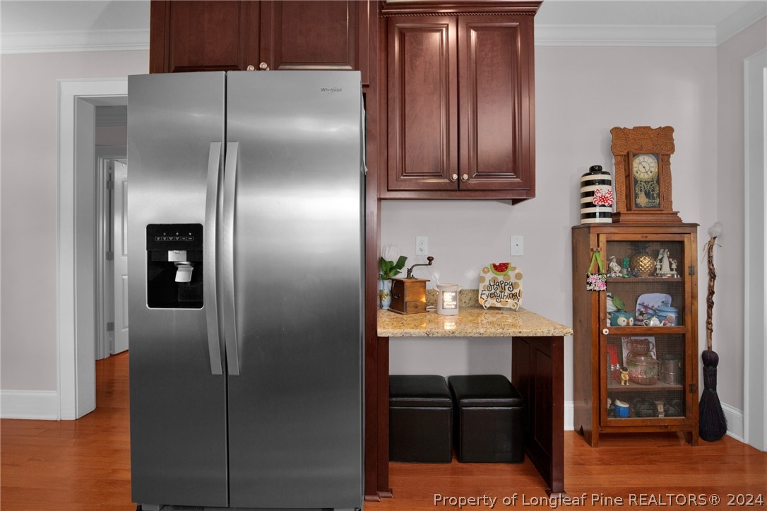 7311 Maxwell Road Stedman, NC 28391 - Photo 15 of 37 a kitchen with stainless steel appliances granite countertop a refrigerator and a sink