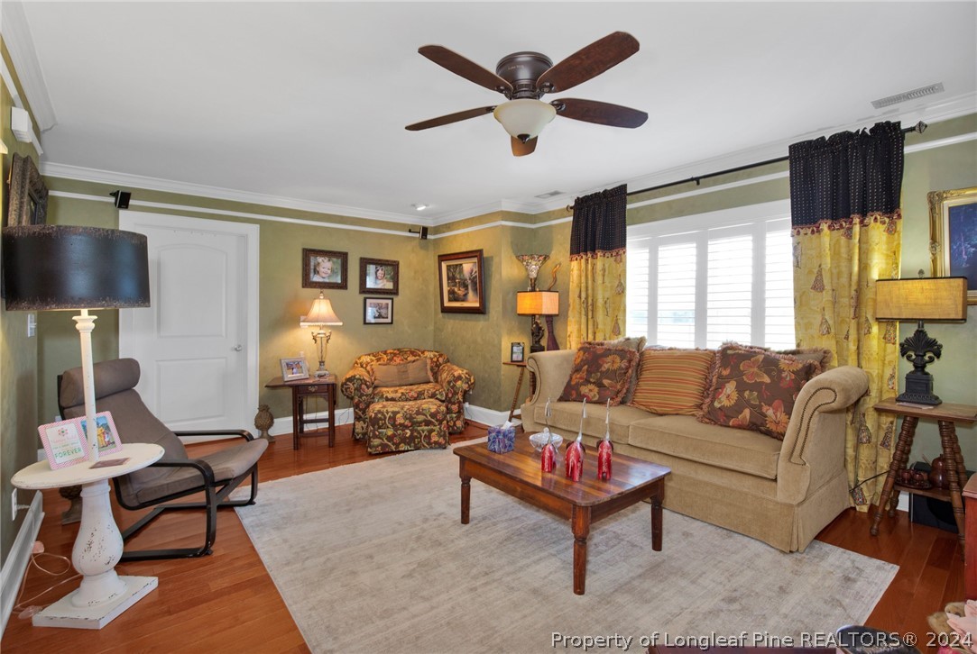 7311 Maxwell Road Stedman, NC 28391 - Photo 8 of 37 a living room with furniture and a large window