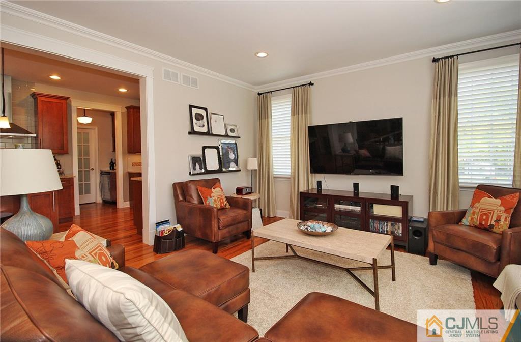 5 Timber Road Edison, NJ 08820 - Photo 13 of 24 a living room with furniture and a flat screen tv
