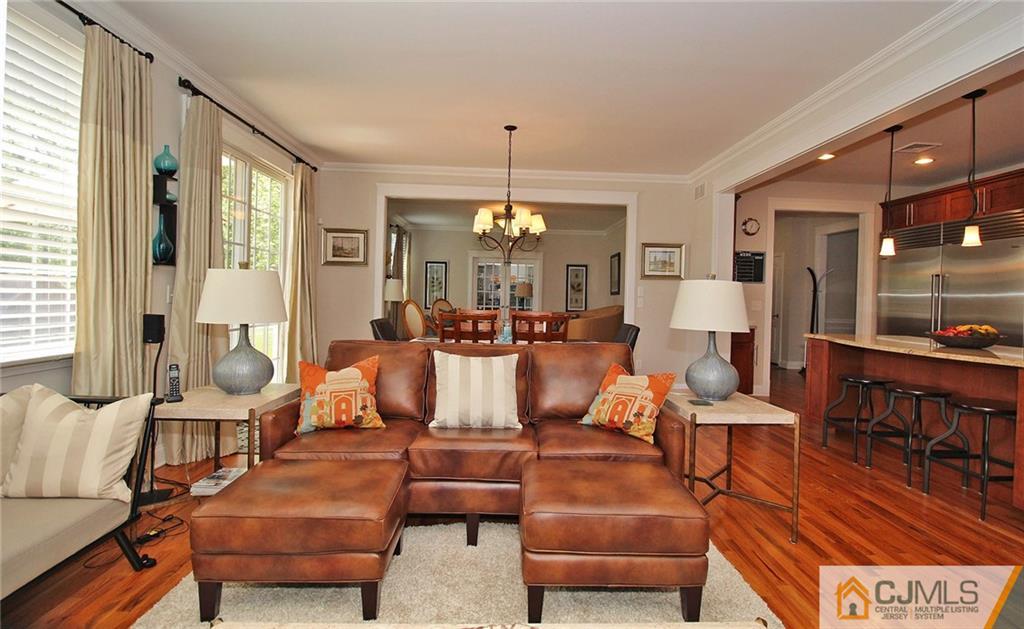 5 Timber Road Edison, NJ 08820 - Photo 14 of 24 a living room with furniture and a chandelier