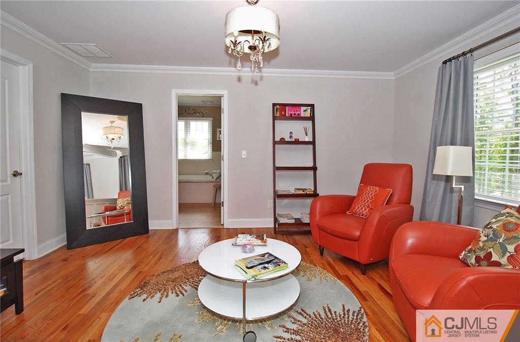 5 Timber Road Edison, NJ 08820 - Photo 16 of 24 a living room with furniture and a wooden floor