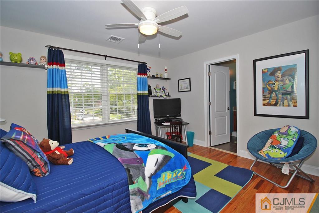 5 Timber Road Edison, NJ 08820 - Photo 20 of 24 a bedroom with a bed and windows