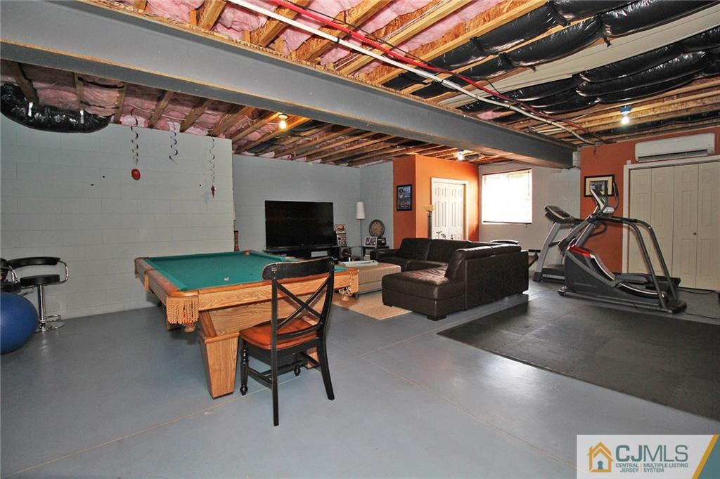5 Timber Road Edison, NJ 08820 - Photo 21 of 24 a room with furniture and a flat screen tv