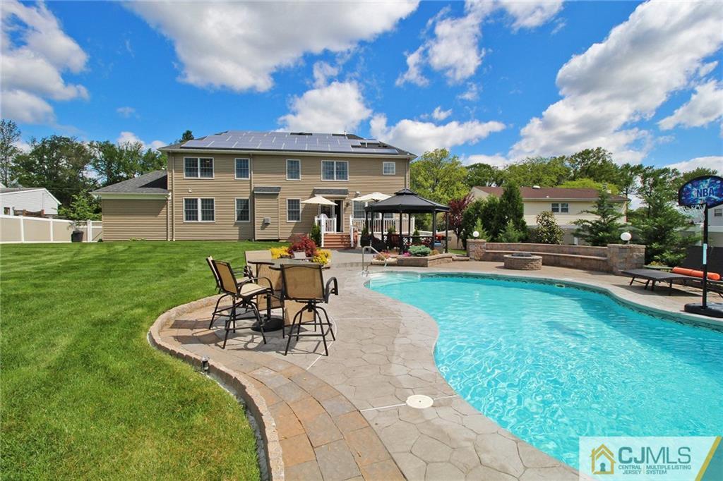 5 Timber Road Edison, NJ 08820 - Photo 23 of 24 a view of a house with swimming pool and sitting area