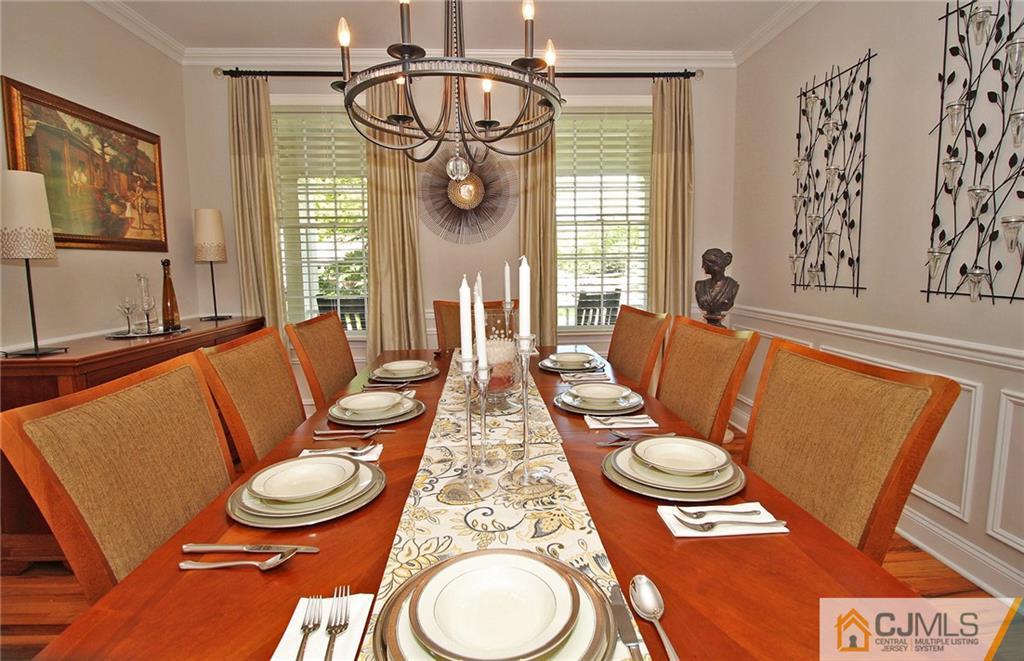 5 Timber Road Edison, NJ 08820 - Photo 6 of 24 a dining room with furniture a chandelier and wooden floor