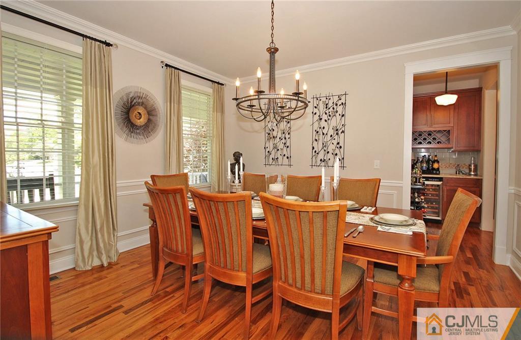 5 Timber Road Edison, NJ 08820 - Photo 7 of 24 a view of a dining room with furniture wooden floor and chandelier