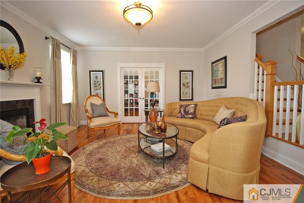 5 Timber Road Edison, NJ 08820 - Photo 9 of 24 a living room with furniture and a fireplace