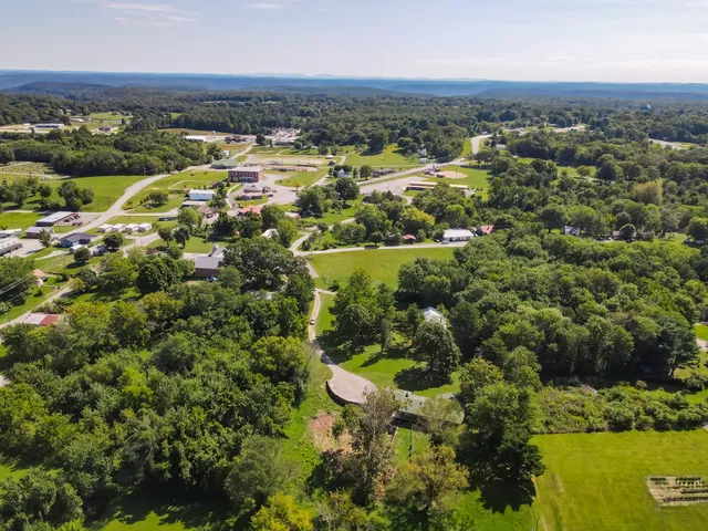 a view of a two chairs in the balcony