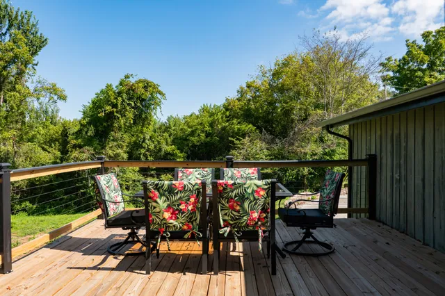 a kitchen with a stove a sink and a window