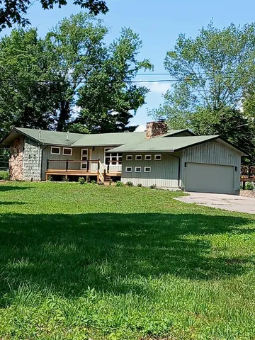 a view of a back yard with green space