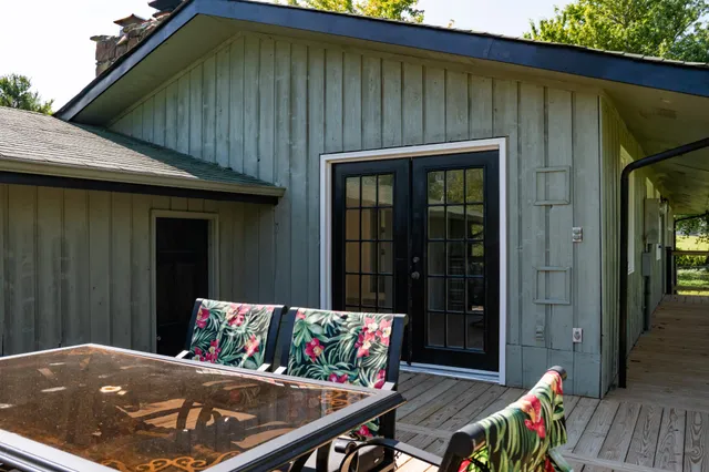 a view of empty room with windows and wooden floor