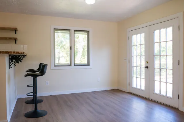 a bathroom with a sink a shower and a mirror