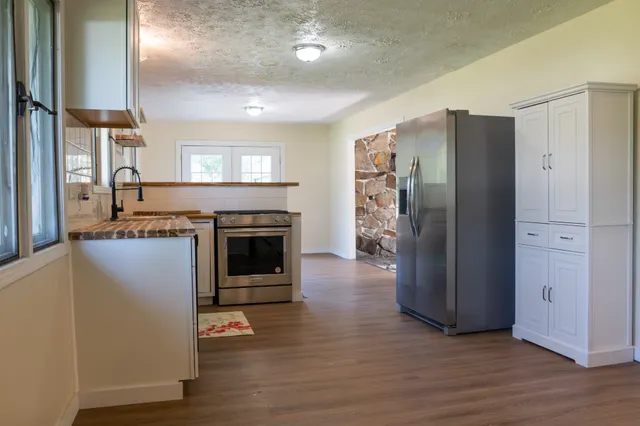 a view of water heater room with fireplace