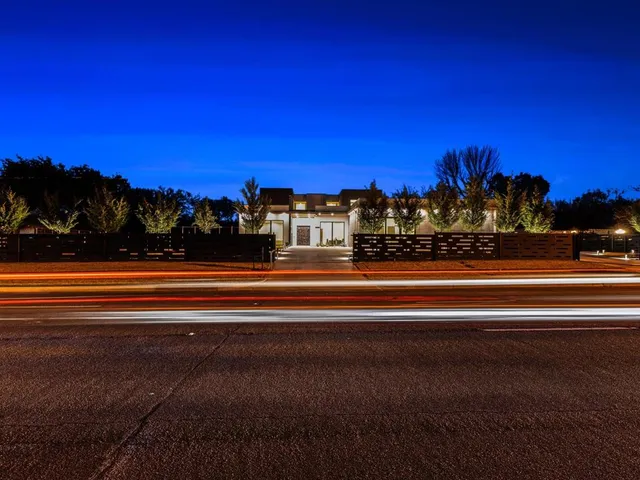 a view of a house with backyard and porch