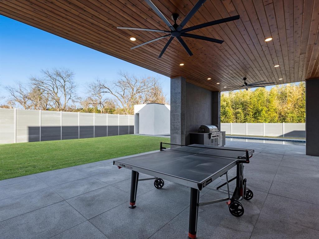 10230 Marsh Lane Dallas, TX 75229 - Photo 11 of 31 a view of a porch with furniture and a yard