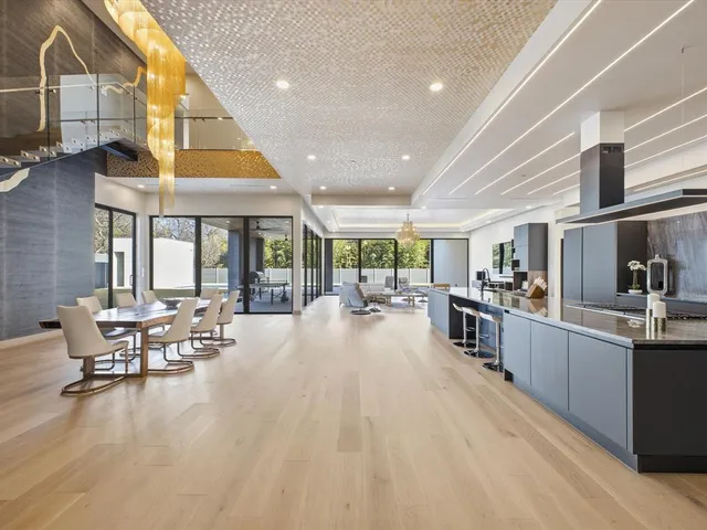 a kitchen with stainless steel appliances wooden cabinets and sink