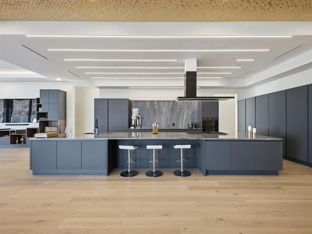 10230 Marsh Lane Dallas, TX 75229 - Photo 15 of 31 a kitchen with stainless steel appliances wooden cabinets and sink