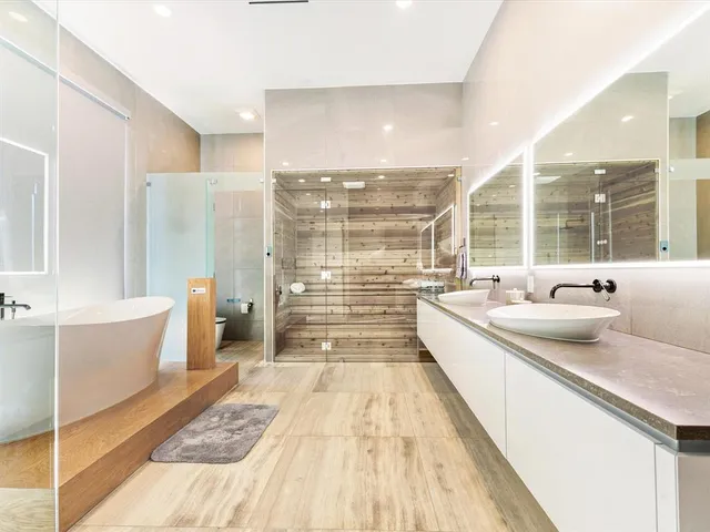 a view of a room with gym equipment and view of living room