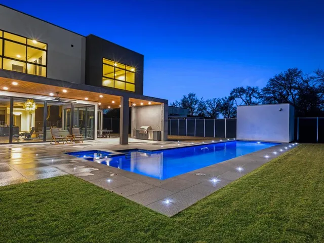 a view of a porch with furniture and a yard
