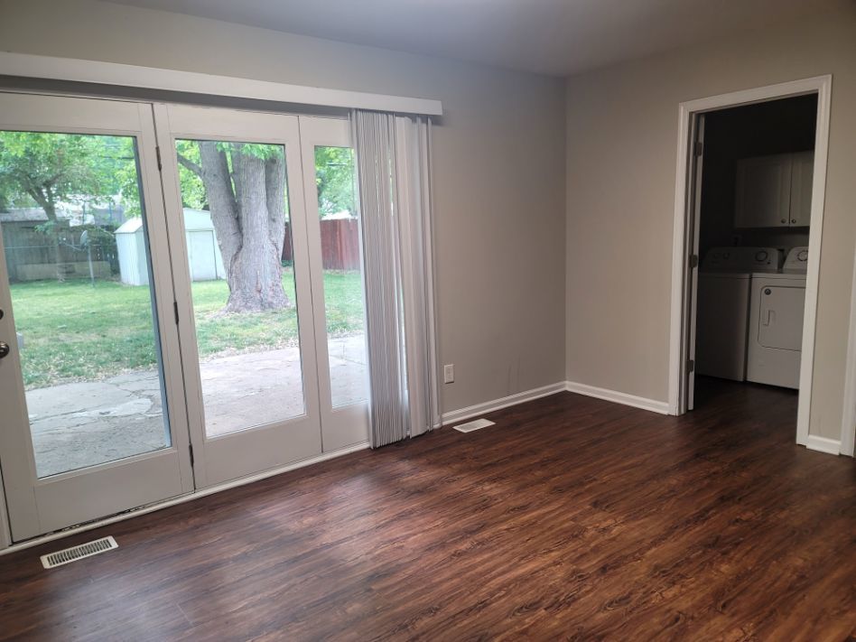62 Springdale Road Montgomery, IL 60538 - Photo 11 of 12 a view of an empty room with wooden floor and a window