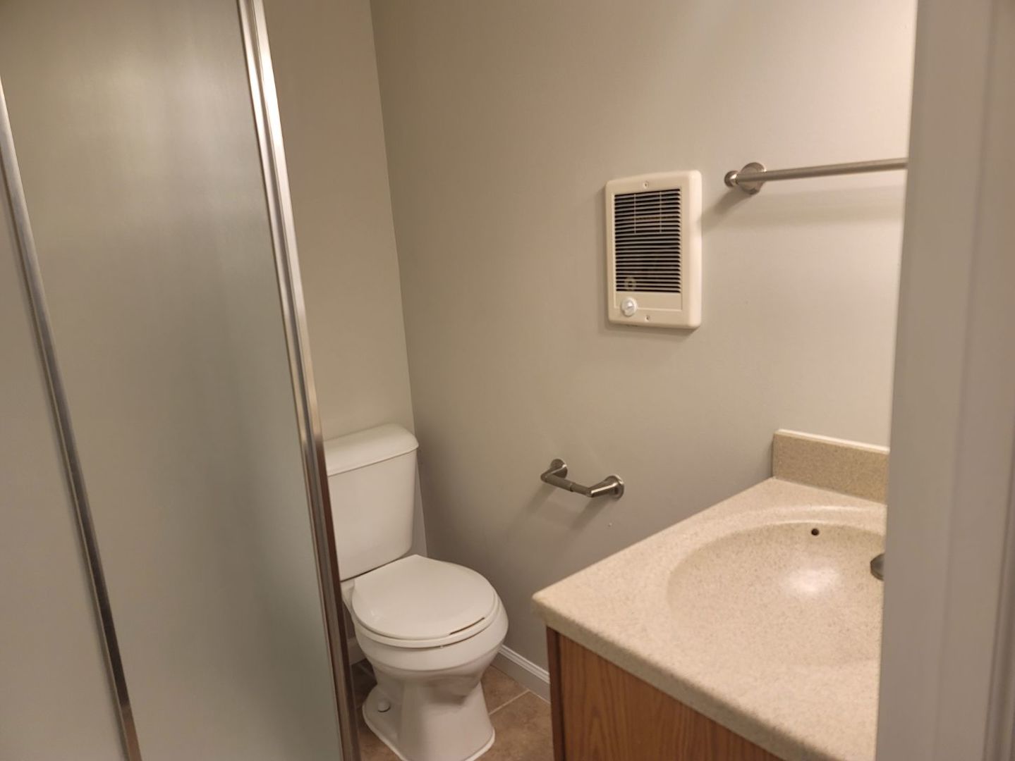 62 Springdale Road Montgomery, IL 60538 - Photo 10 of 12 a white toilet sitting next to a bathroom sink
