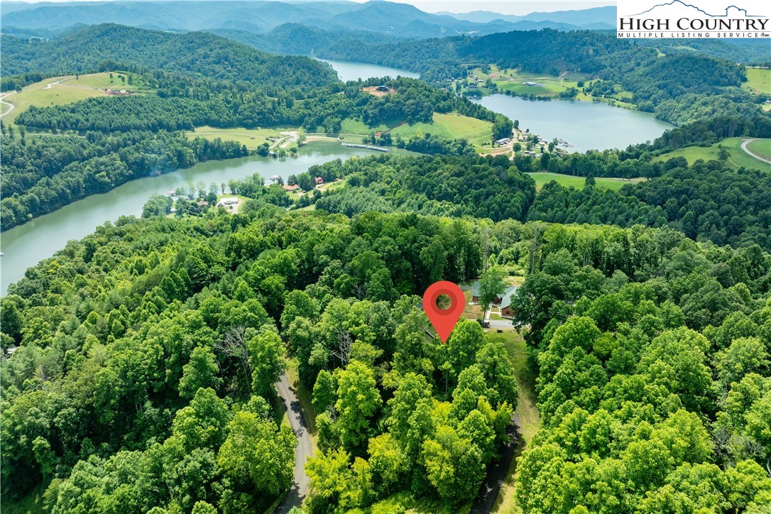 Lot 17 Lake Ridge Butler, TN 37640 - Photo 7 of 28 an aerial view of a house with a lake view