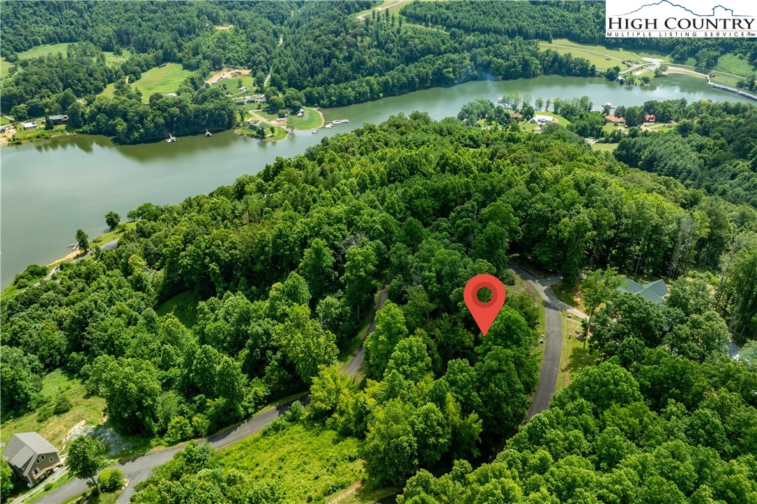 Lot 17 Lake Ridge Butler, TN 37640 - Photo 9 of 28 an aerial view of a house with a yard and lake view
