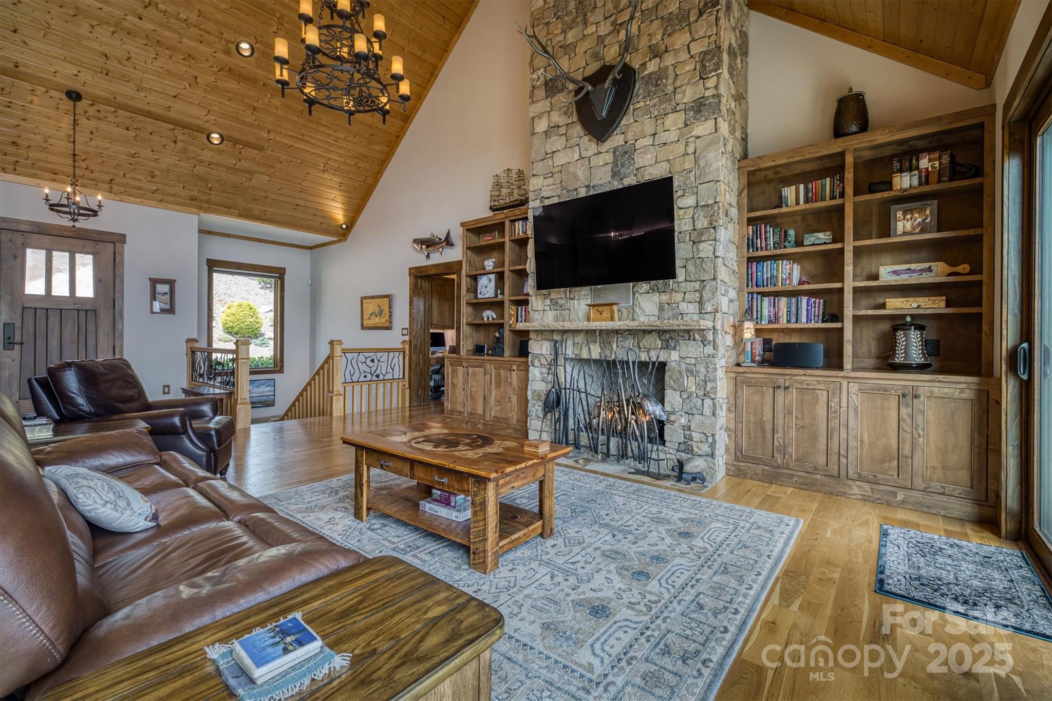 597 Waterglyn Way Nebo, NC 28761 - Photo 11 of 44 a living room with furniture and a flat screen tv