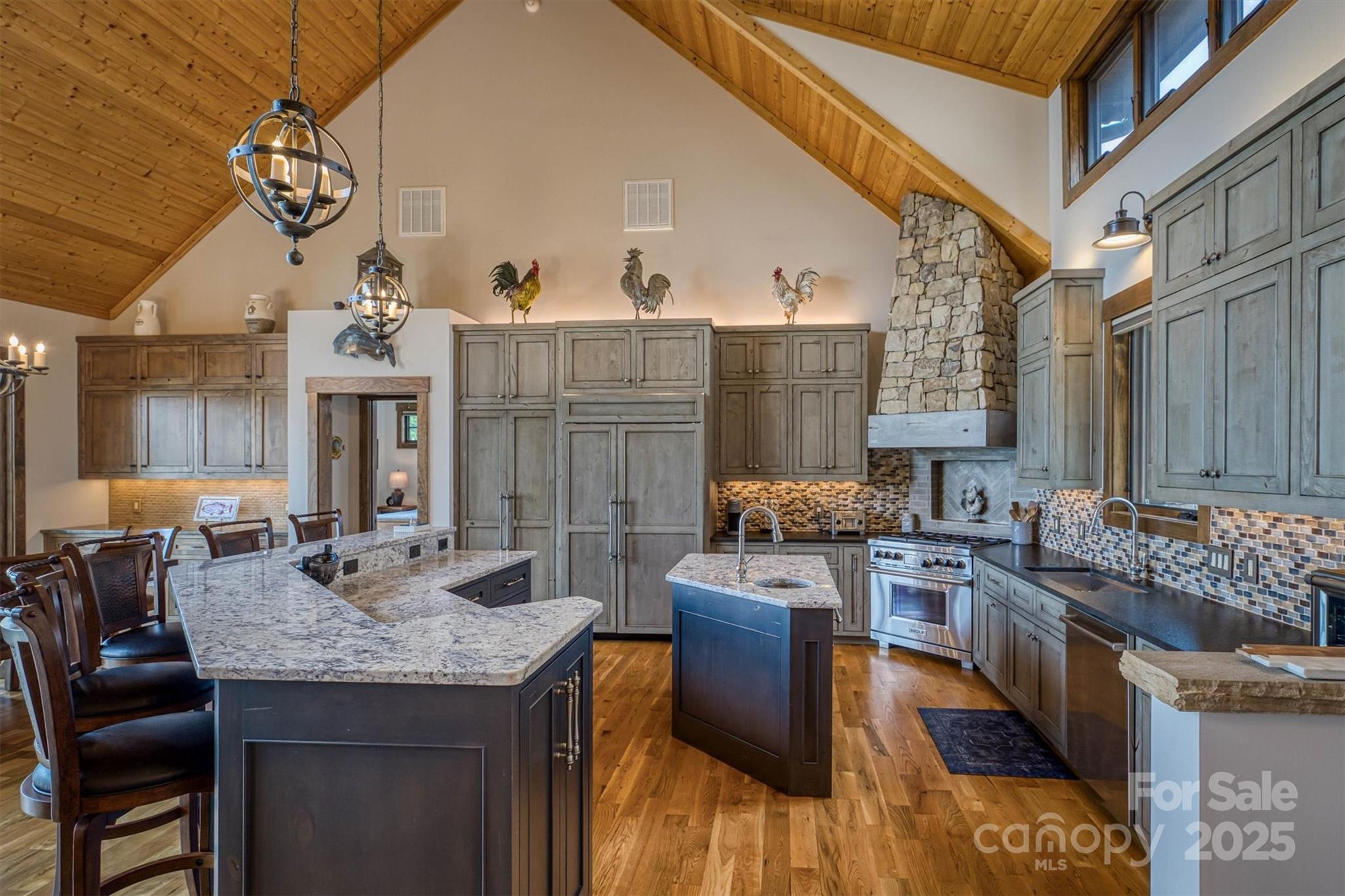 597 Waterglyn Way Nebo, NC 28761 - Photo 16 of 44 a kitchen with granite countertop a stove and cabinets