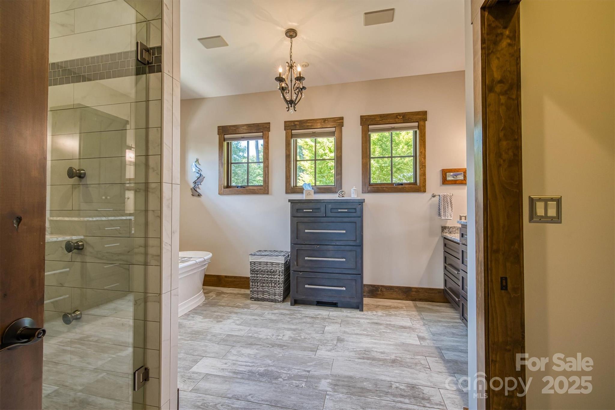 597 Waterglyn Way Nebo, NC 28761 - Photo 19 of 44 a view of bathroom with a shower and a sink
