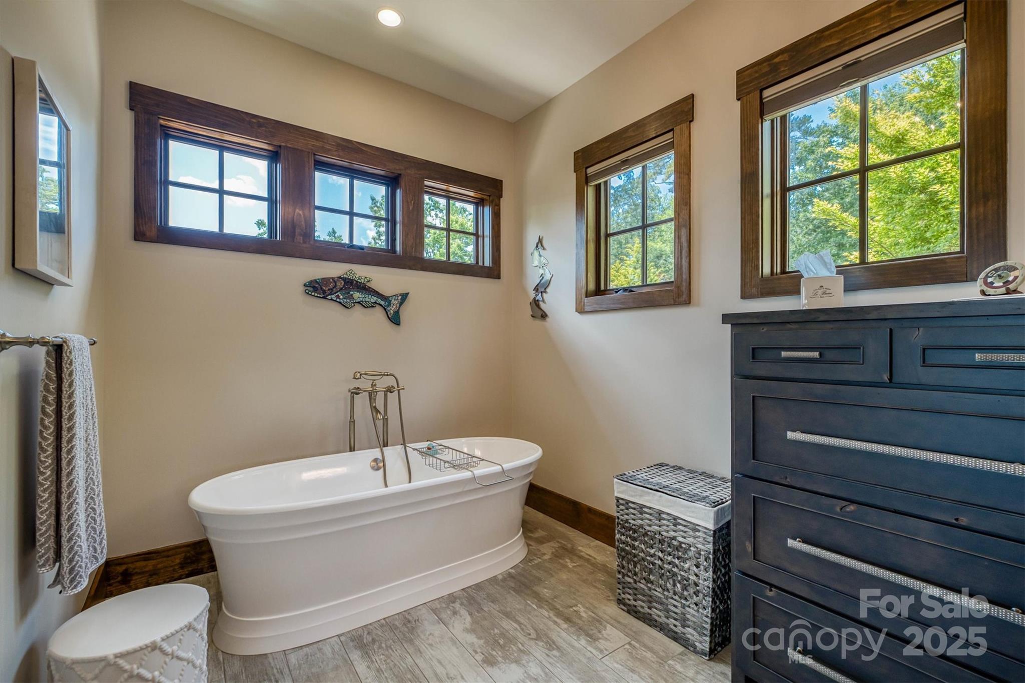 597 Waterglyn Way Nebo, NC 28761 - Photo 21 of 44 a bathroom with a bathtub and window