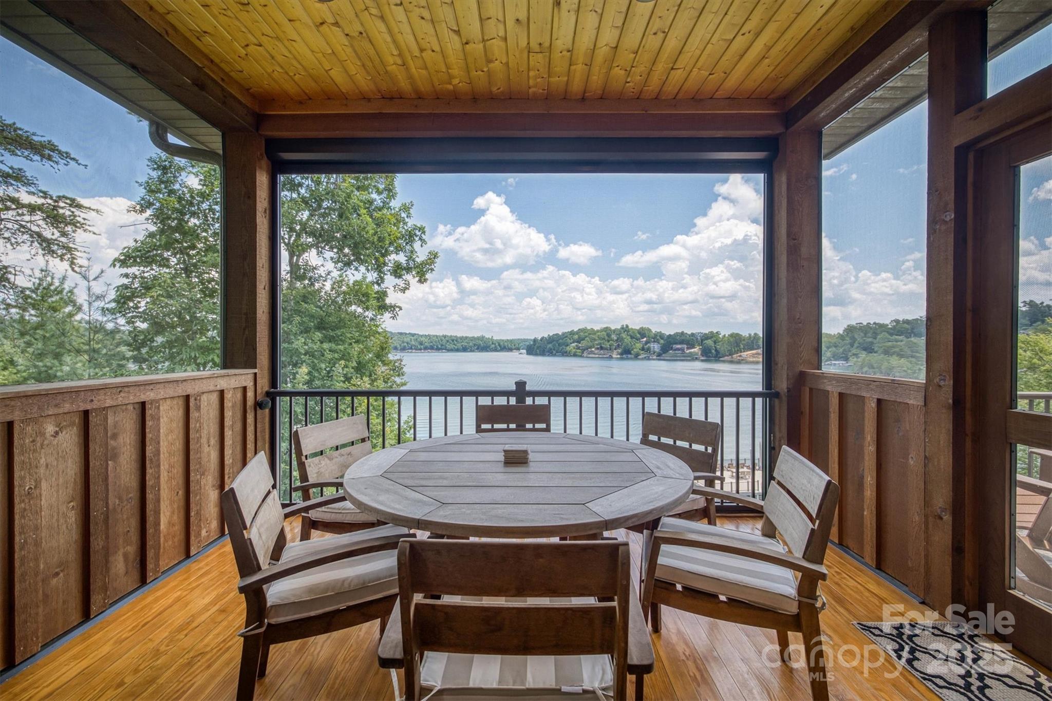 597 Waterglyn Way Nebo, NC 28761 - Photo 24 of 44 a view of a balcony with a table and chairs