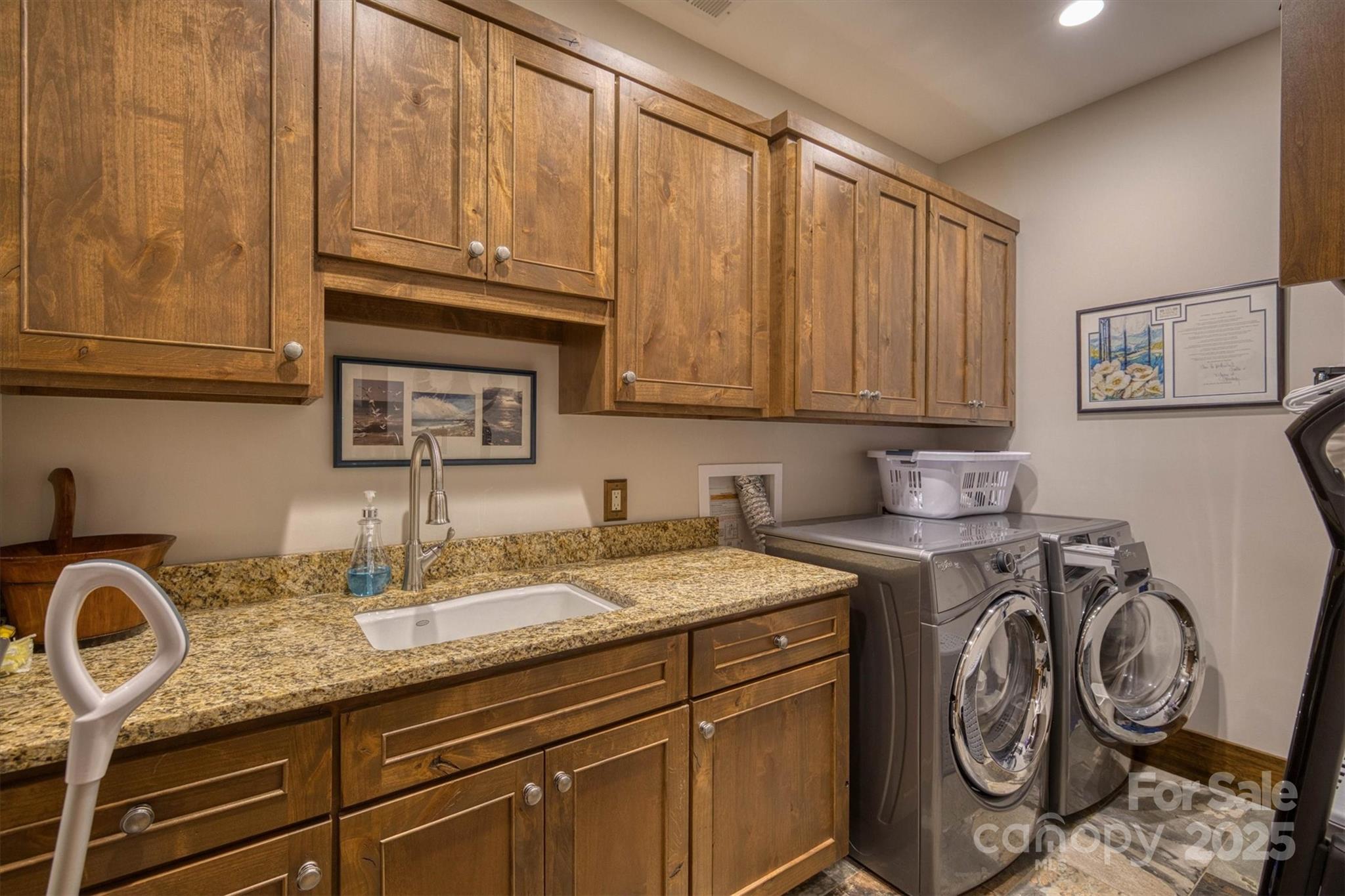 597 Waterglyn Way Nebo, NC 28761 - Photo 31 of 44 a sink with granite countertop a sink and cabinets