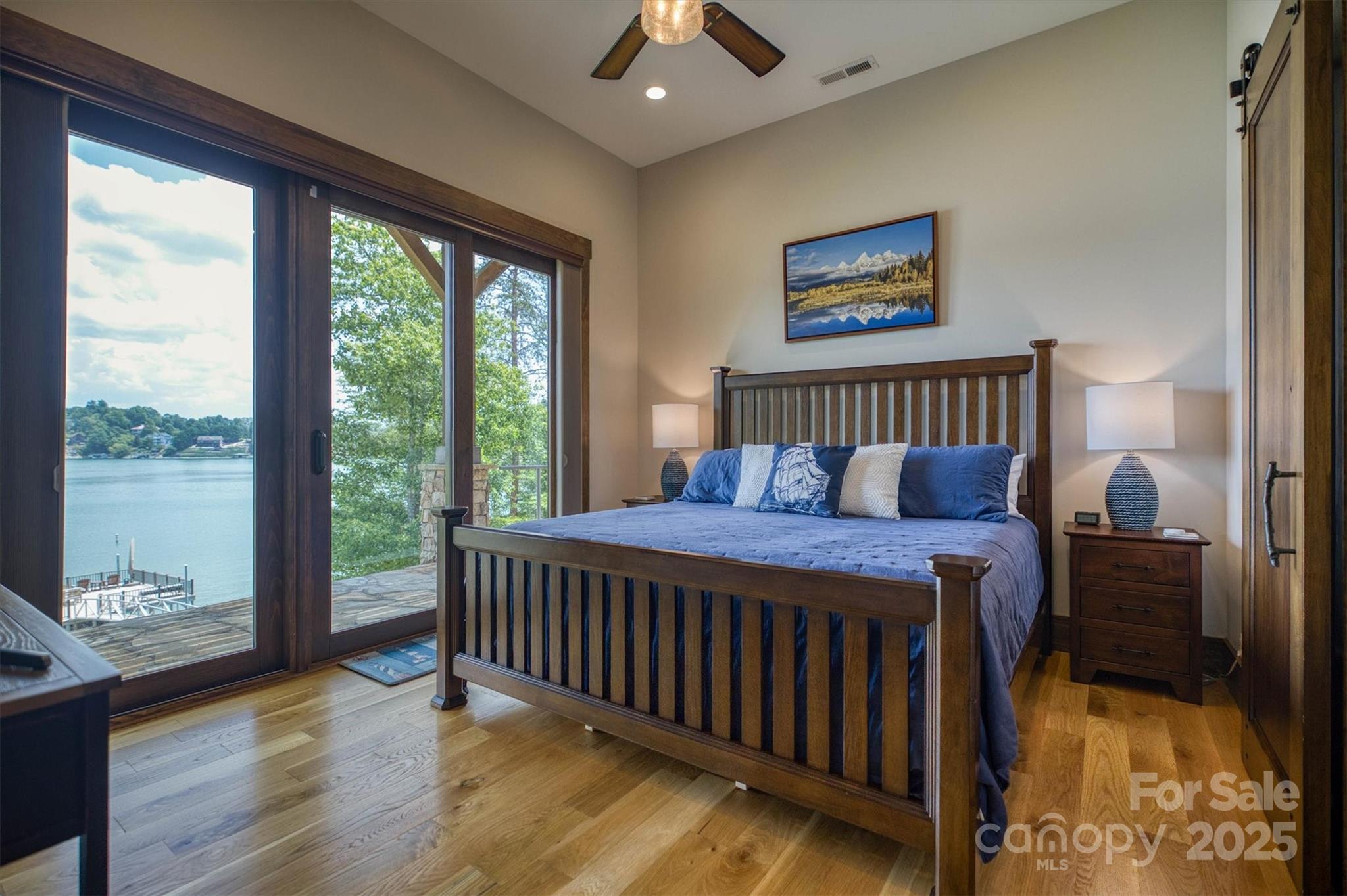 597 Waterglyn Way Nebo, NC 28761 - Photo 34 of 44 a bed sitting in a bedroom next to a window