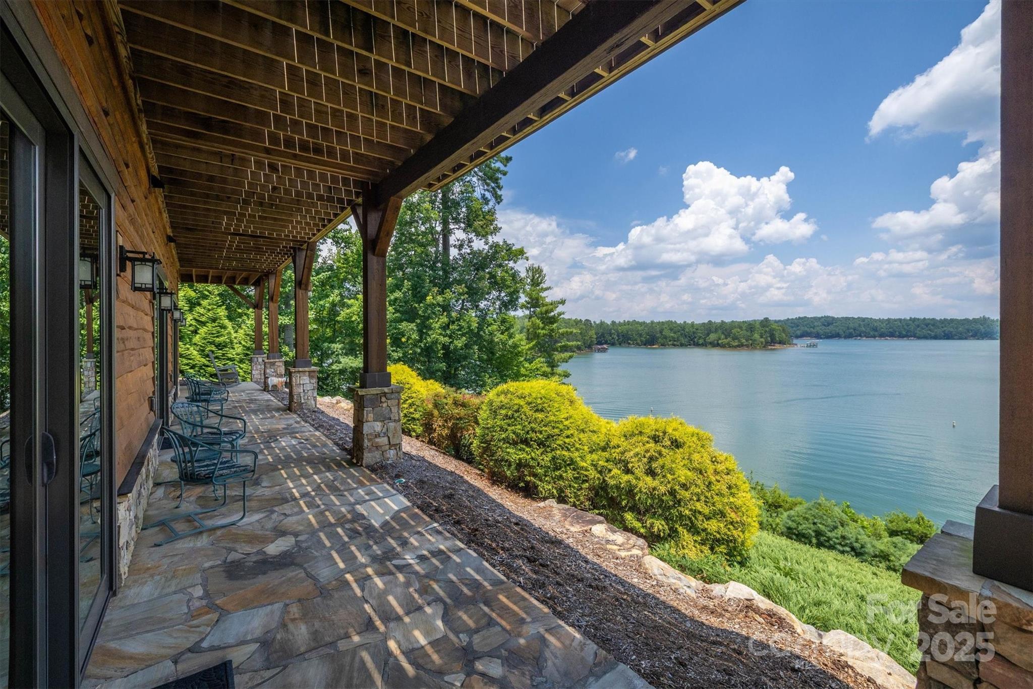 597 Waterglyn Way Nebo, NC 28761 - Photo 38 of 44 a backyard of a house with lots of green space and lake view