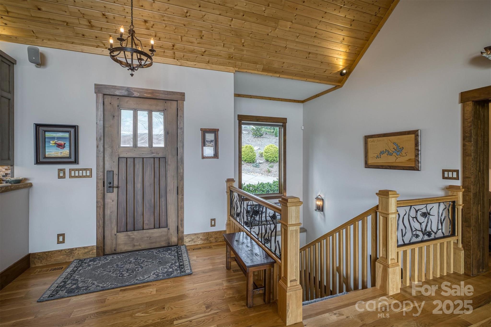 597 Waterglyn Way Nebo, NC 28761 - Photo 9 of 44 a view of a hallway with wooden floor and entryway